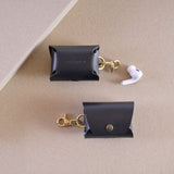 Handcrafted case for AirPods in black leather with messing clip, with earbuds. Cases for AirPods Pro 2, AirPods Pro 3 and AirPods 4.