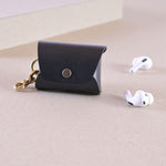 Case for AirPods in black leather with messing clip, with earbuds. Cases for AirPods Pro 2, AirPods Pro 3 and AirPods 4.