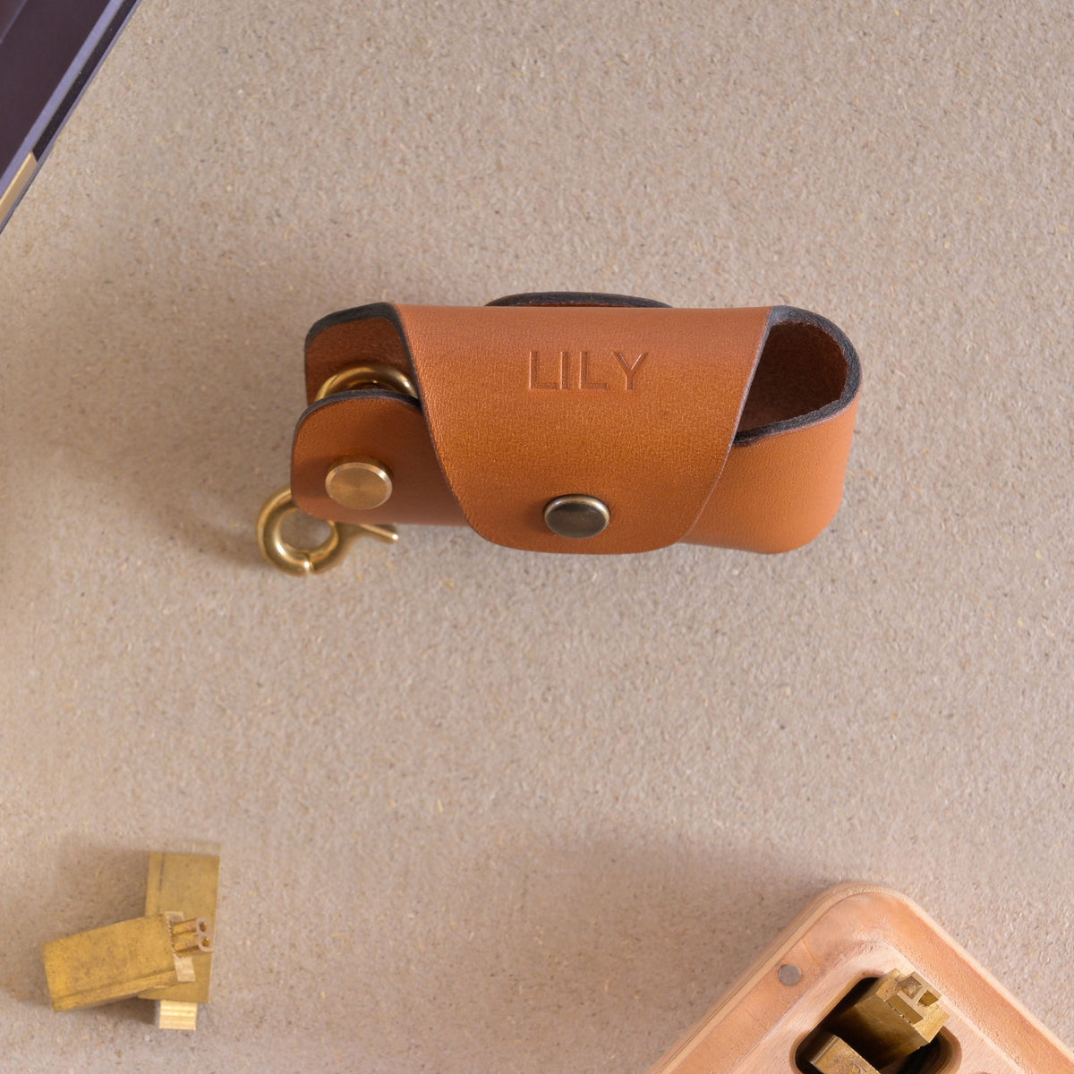 Hot foil monogram embossing on Nitmoi Italian leather goods